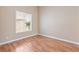 Bright bedroom with hardwood floors and a large window for plenty of natural light at 6224 Red Pine Ct, Las Vegas, NV 89130