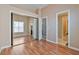 Bedroom with hardwood floors, large mirrored closets, and ensuite bathroom at 6224 Red Pine Ct, Las Vegas, NV 89130