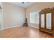 Bedroom with hardwood floors featuring a ceiling fan, window, and closet at 6224 Red Pine Ct, Las Vegas, NV 89130