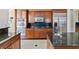 Close up of the kitchen area with stainless steel appliances and a granite countertop at 6224 Red Pine Ct, Las Vegas, NV 89130