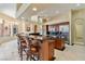 Bright and spacious kitchen featuring an island with barstool seating, granite, and stainless appliances at 6224 Red Pine Ct, Las Vegas, NV 89130