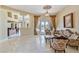 Spacious living room featuring marble floors, decorative columns, and access to backyard at 6224 Red Pine Ct, Las Vegas, NV 89130