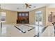 Spacious living room with custom built-ins, marble floors, and double doors to the backyard at 6224 Red Pine Ct, Las Vegas, NV 89130