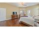 Spacious main bedroom featuring hardwood floors, a ceiling fan, and an ensuite bathroom at 6224 Red Pine Ct, Las Vegas, NV 89130