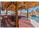 Outdoor kitchen area with grill, countertop space, and bar seating near the custom pool at 6224 Red Pine Ct, Las Vegas, NV 89130