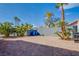 A brick patio, mature palms, and a sturdy block wall combine for a private backyard space at 6259 Santander Ave, Las Vegas, NV 89103