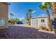 Paver patio with storage shed and shade trees create a welcoming outdoor retreat at 6259 Santander Ave, Las Vegas, NV 89103