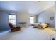 Large bedroom with comfortable seating, ample natural light, and a bed at 6259 Santander Ave, Las Vegas, NV 89103