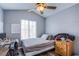 Cozy bedroom featuring a comfortable bed, desk area, and natural light at 6259 Santander Ave, Las Vegas, NV 89103