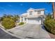 Charming two-story home featuring a well-manicured lawn and a two-car garage in a sunny, suburban neighborhood at 6259 Santander Ave, Las Vegas, NV 89103