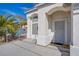 Home's inviting entryway features a secure screen door, arched window, and a landscaped garden view at 6259 Santander Ave, Las Vegas, NV 89103