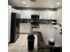 Well-lit kitchen with white cabinetry, modern appliances, and a functional layout for easy meal preparation at 6259 Santander Ave, Las Vegas, NV 89103