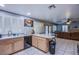 Open kitchen with ample counter space, cabinetry, a breakfast bar, and easy access to the living area at 6259 Santander Ave, Las Vegas, NV 89103