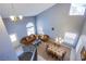 Overhead view of living room featuring dining area, couches, and staircase at 6259 Santander Ave, Las Vegas, NV 89103
