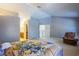 Spacious main bedroom with vaulted ceilings, seating area, and en-suite bathroom at 6259 Santander Ave, Las Vegas, NV 89103