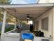 Covered patio with ceiling fans offers a cool retreat, complete with a small pool at 6259 Santander Ave, Las Vegas, NV 89103
