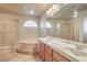 Bathroom with double sink vanity, soaking tub, and a separate shower stall at 6559 Musette Ave, Las Vegas, NV 89139