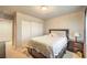 Inviting bedroom featuring a comfortable bed, closet and a nightstand with drawers at 6559 Musette Ave, Las Vegas, NV 89139
