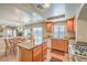 Spacious kitchen featuring an island, modern appliances, and an open layout to the living area at 6559 Musette Ave, Las Vegas, NV 89139