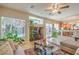 Bright living area with comfortable seating, fireplace, and an open layout to the kitchen at 6559 Musette Ave, Las Vegas, NV 89139