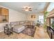 Comfortable living room with a plush sectional sofa, ceiling fan, and stylish decor at 6559 Musette Ave, Las Vegas, NV 89139