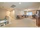Spacious living room with neutral carpet, a ceiling fan, and comfortable seating area for relaxation at 6559 Musette Ave, Las Vegas, NV 89139