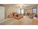 Large primary bedroom with a ceiling fan, natural light, and neutral decor at 6559 Musette Ave, Las Vegas, NV 89139
