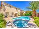 Inviting backyard pool and spa with lush landscaping and patio area, perfect for outdoor entertaining at 6559 Musette Ave, Las Vegas, NV 89139