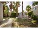 Lushly landscaped backyard features a tranquil rock water feature and privacy wall at 66 Sunset Bay St, Las Vegas, NV 89148