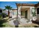 Outdoor patio featuring a covered area, lush landscaping, and well-maintained lawn for relaxation and entertaining at 66 Sunset Bay St, Las Vegas, NV 89148