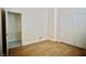 Spare bedroom featuring wood floors and a closet with bi-fold doors at 66 Sunset Bay St, Las Vegas, NV 89148
