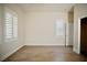 Bright bedroom featuring light-colored walls, wood-look flooring and plantation shutters for comfortable living at 66 Sunset Bay St, Las Vegas, NV 89148