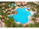 Aerial shot of large community pool featuring ample lounging space and lush tropical landscaping at 66 Sunset Bay St, Las Vegas, NV 89148