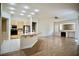 Spacious kitchen features an island bar with granite countertops and flows into the living area at 66 Sunset Bay St, Las Vegas, NV 89148