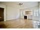 Cozy living area boasts a fireplace, hardwood floors, and plantation shutters for ample natural light at 66 Sunset Bay St, Las Vegas, NV 89148