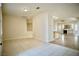 View of open-concept living space with tile and wood floors, leading to the kitchen and fireplace at 66 Sunset Bay St, Las Vegas, NV 89148