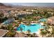 Beautiful community pool area with lush landscaping and resort-style amenities in a desirable neighborhood at 66 Sunset Bay St, Las Vegas, NV 89148