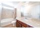 Bathroom with a vanity, a toilet, and a bathtub with shower at 6821 Treble Clef Ave, Las Vegas, NV 89139