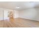 The bedroom has wood floors and neutral-colored walls with access to the upstairs hallway at 6821 Treble Clef Ave, Las Vegas, NV 89139