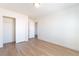A spacious bedroom with light hardwood flooring and a closet with white doors offers ample storage at 6821 Treble Clef Ave, Las Vegas, NV 89139
