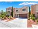 Charming two-story home with a well-maintained lawn and a two-car garage at 6821 Treble Clef Ave, Las Vegas, NV 89139