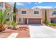Charming two-story home with a well-maintained lawn and a two-car garage at 6821 Treble Clef Ave, Las Vegas, NV 89139