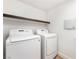 Laundry room with a shelf, a washing machine and a clothes dryer at 6821 Treble Clef Ave, Las Vegas, NV 89139
