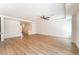 Bright open living room with wood floors and recessed lighting at 6821 Treble Clef Ave, Las Vegas, NV 89139