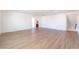 Spacious living room with hardwood floors and white walls at 6821 Treble Clef Ave, Las Vegas, NV 89139