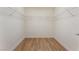 Empty walk-in closet with wood-look flooring and wire shelving at 6821 Treble Clef Ave, Las Vegas, NV 89139
