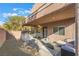 A view of the backyard highlighting the patio, outdoor kitchen and gravel at 6837 Dragonfly Rock St, Las Vegas, NV 89148