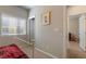 Bright bedroom featuring a window with blinds, carpet flooring, and neutral wall colors at 6837 Dragonfly Rock St, Las Vegas, NV 89148