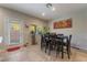 Bright dining area features a modern table set and access to the backyard at 6837 Dragonfly Rock St, Las Vegas, NV 89148