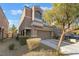 Charming two-story home with a well-maintained front yard and attached two-car garage at 6837 Dragonfly Rock St, Las Vegas, NV 89148